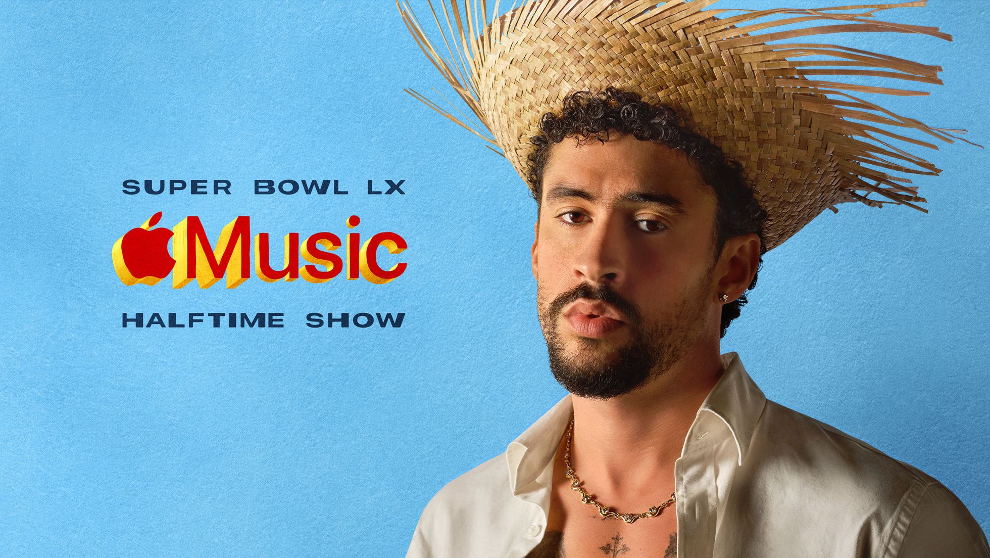 Promotional image for the Apple Music Super Bowl LX Halftime Show. On the right, artist Bad Bunny looks directly at the camera wearing a frayed straw hat, a white button-down shirt, and a gold chain necklace. To the left, the Apple Music logo is rendered in 3D gold and red lettering against a vibrant light blue background, positioned above the words HALFTIME SHOW.