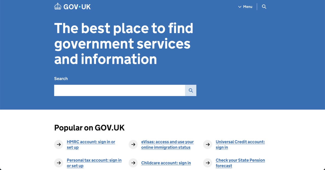 Screenshot of the GOV.UK homepage, featuring a large blue banner with the UK Crown logo and the main heading: The best place to find government services and information. Below the heading is a large white Search bar with a magnifying glass icon. The bottom section of the page, which is white, lists popular links including: HMRC account: sign in or set up, eVisas: access and use your online immigration status, Universal Credit account: sign in, Personal tax account: sign in or set up, Childcare account: sign in, and Check your State Pension forecast.